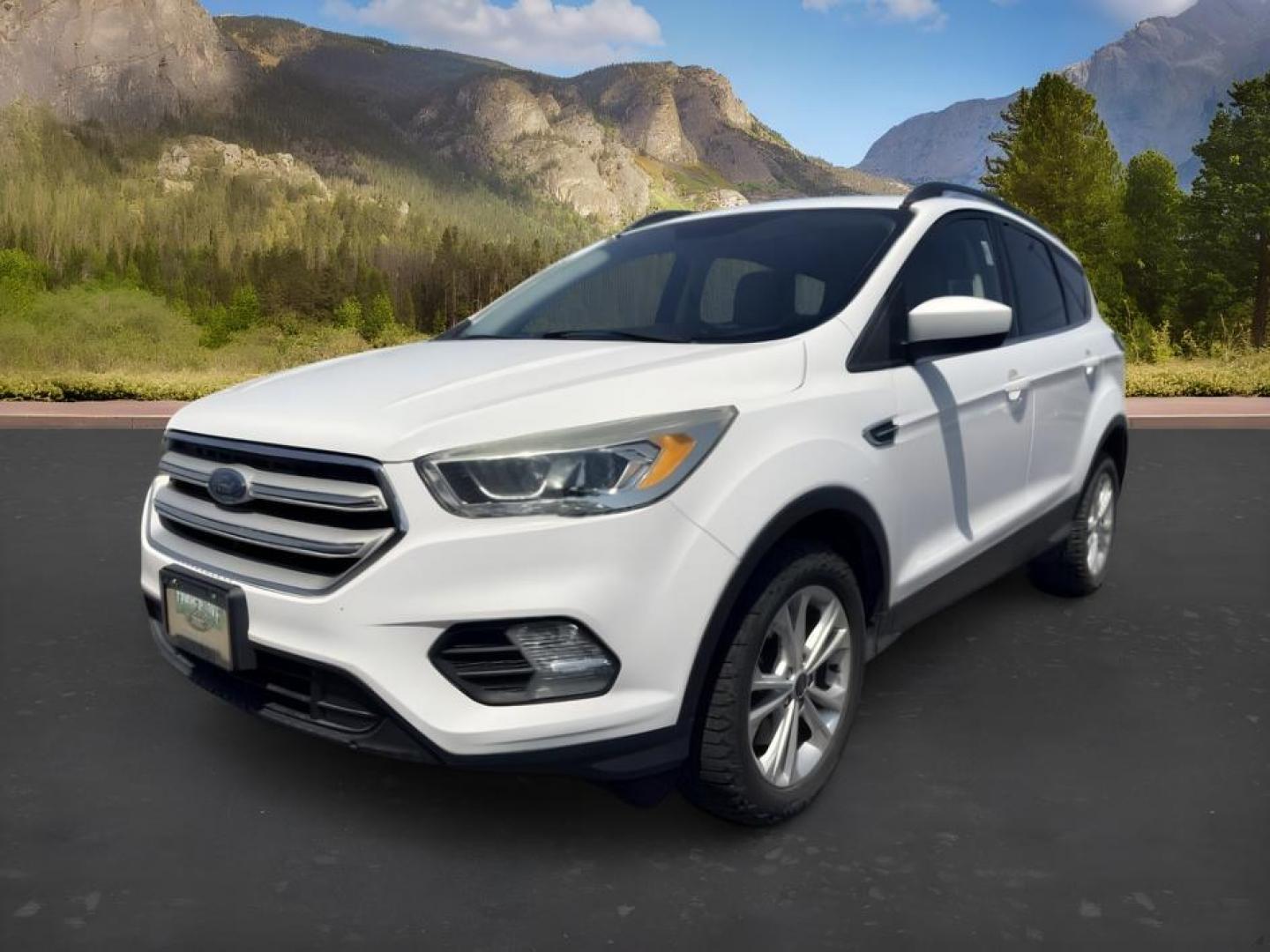 2018 WHITE /Medium Light Stone Ford Escape (1FMCU9HD1JU) with an EcoBoost 15L I-4 gasoline direct injection engine, Automatic transmission, located at 1175 N Woodruff Ave, Idaho Falls, ID, 83401, 43.506901, -111.999657 - At Timberline Auto, finding a great deal on your next vehicle is always easy! Our experienced sales staff goal is to help find you the right vehicle at the right price! Our knowledgeable finance department has options for almost any credit score. We offer extended service contract options to prot- Photo#0
