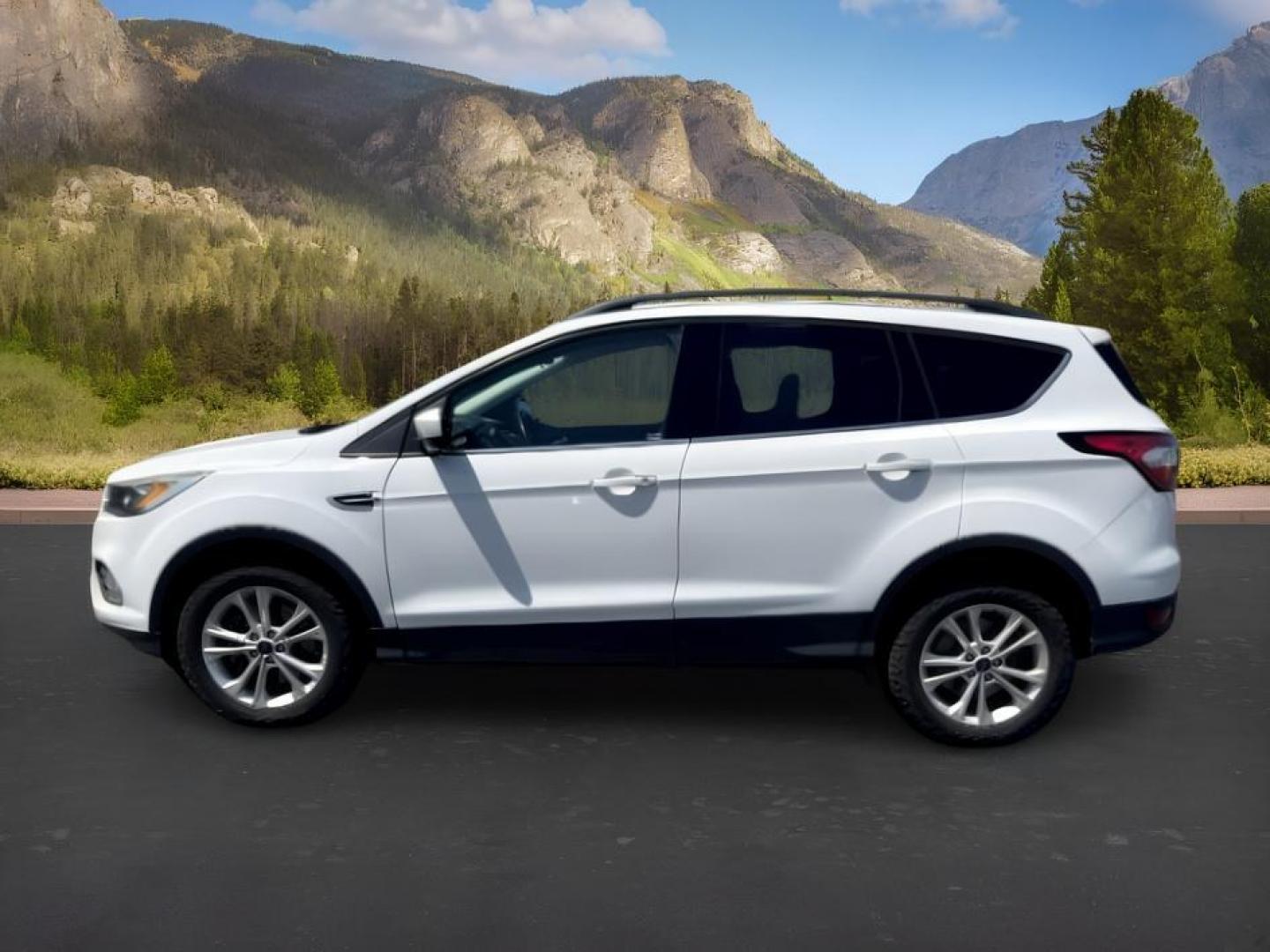 2018 WHITE /Medium Light Stone Ford Escape (1FMCU9HD1JU) with an EcoBoost 15L I-4 gasoline direct injection engine, Automatic transmission, located at 1175 N Woodruff Ave, Idaho Falls, ID, 83401, 43.506901, -111.999657 - At Timberline Auto, finding a great deal on your next vehicle is always easy! Our experienced sales staff goal is to help find you the right vehicle at the right price! Our knowledgeable finance department has options for almost any credit score. We offer extended service contract options to prot- Photo#1