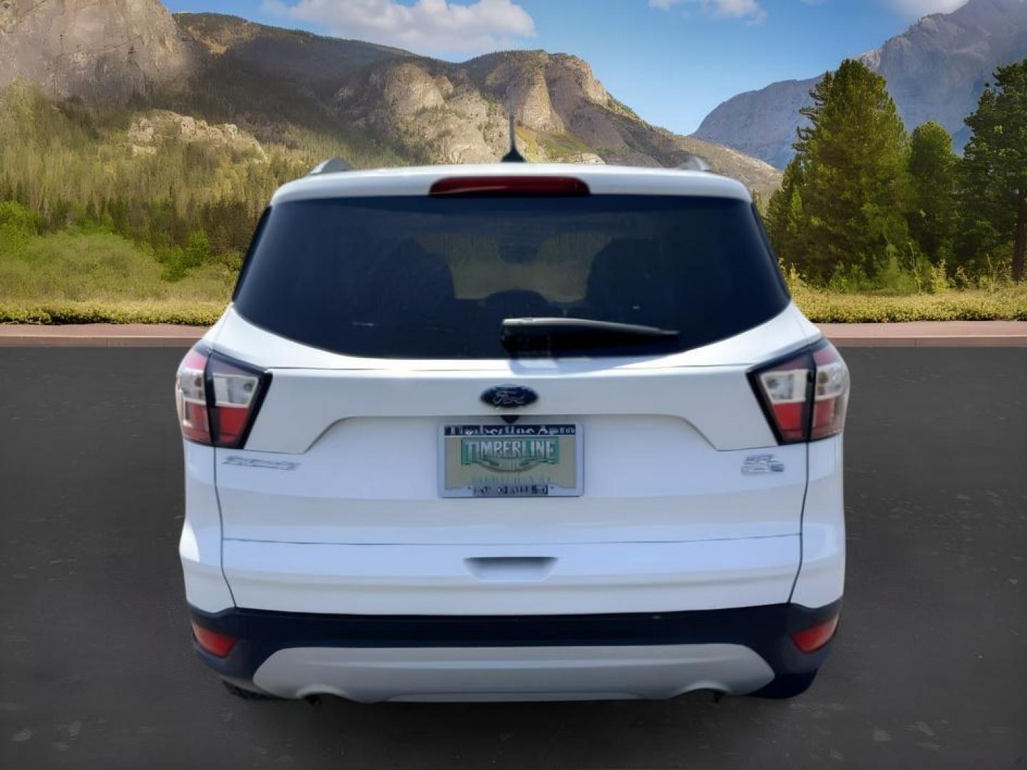 2018 WHITE /Medium Light Stone Ford Escape (1FMCU9HD1JU) with an EcoBoost 15L I-4 gasoline direct injection engine, Automatic transmission, located at 1175 N Woodruff Ave, Idaho Falls, ID, 83401, 43.506901, -111.999657 - At Timberline Auto, finding a great deal on your next vehicle is always easy! Our experienced sales staff goal is to help find you the right vehicle at the right price! Our knowledgeable finance department has options for almost any credit score. We offer extended service contract options to prot- Photo#3