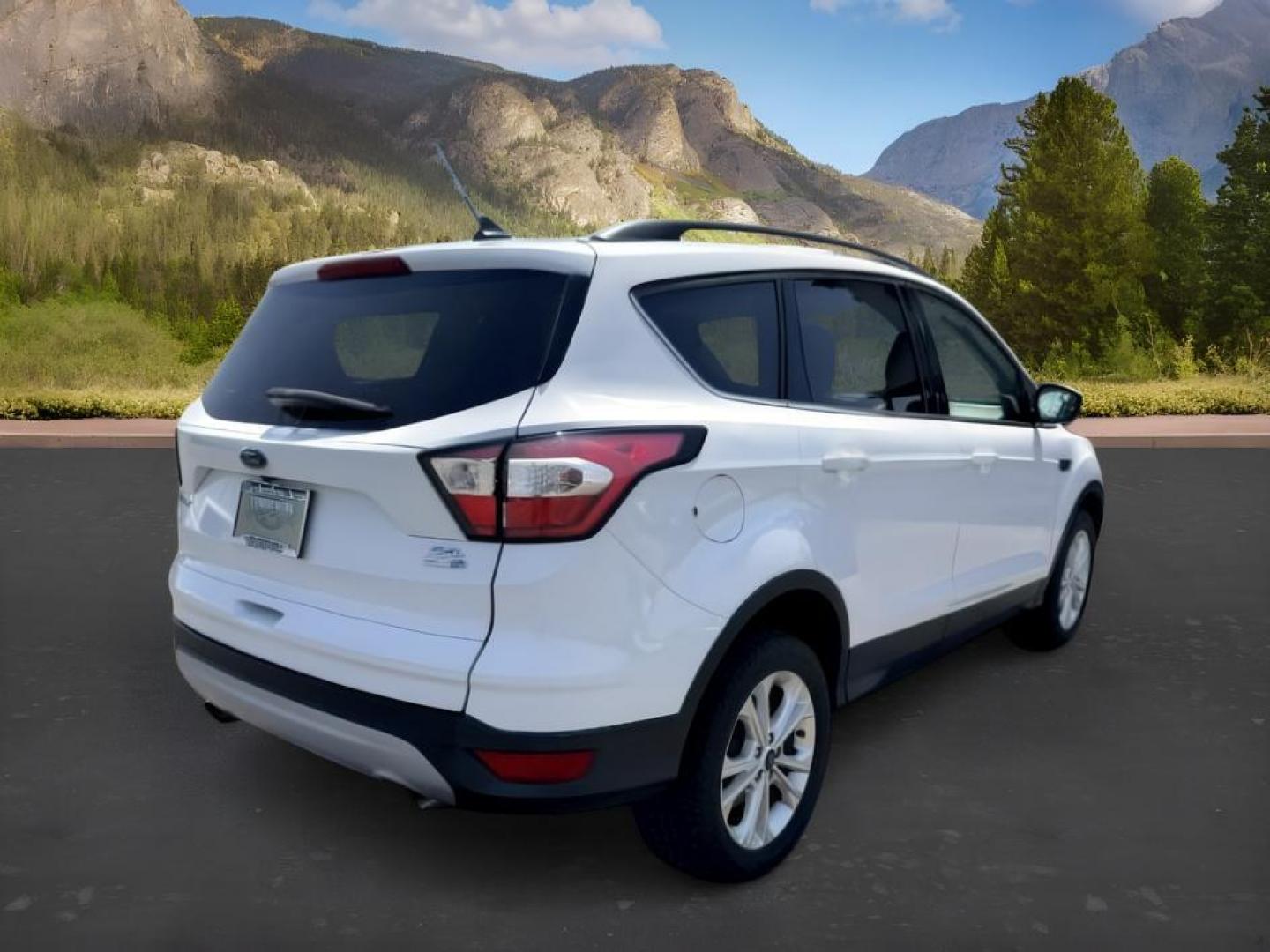 2018 WHITE /Medium Light Stone Ford Escape (1FMCU9HD1JU) with an EcoBoost 15L I-4 gasoline direct injection engine, Automatic transmission, located at 1175 N Woodruff Ave, Idaho Falls, ID, 83401, 43.506901, -111.999657 - At Timberline Auto, finding a great deal on your next vehicle is always easy! Our experienced sales staff goal is to help find you the right vehicle at the right price! Our knowledgeable finance department has options for almost any credit score. We offer extended service contract options to prot- Photo#8