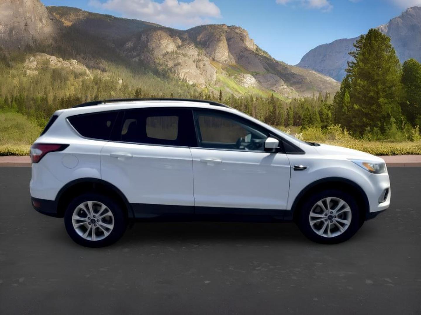 2018 WHITE /Medium Light Stone Ford Escape (1FMCU9HD1JU) with an EcoBoost 15L I-4 gasoline direct injection engine, Automatic transmission, located at 1175 N Woodruff Ave, Idaho Falls, ID, 83401, 43.506901, -111.999657 - At Timberline Auto, finding a great deal on your next vehicle is always easy! Our experienced sales staff goal is to help find you the right vehicle at the right price! Our knowledgeable finance department has options for almost any credit score. We offer extended service contract options to prot- Photo#9
