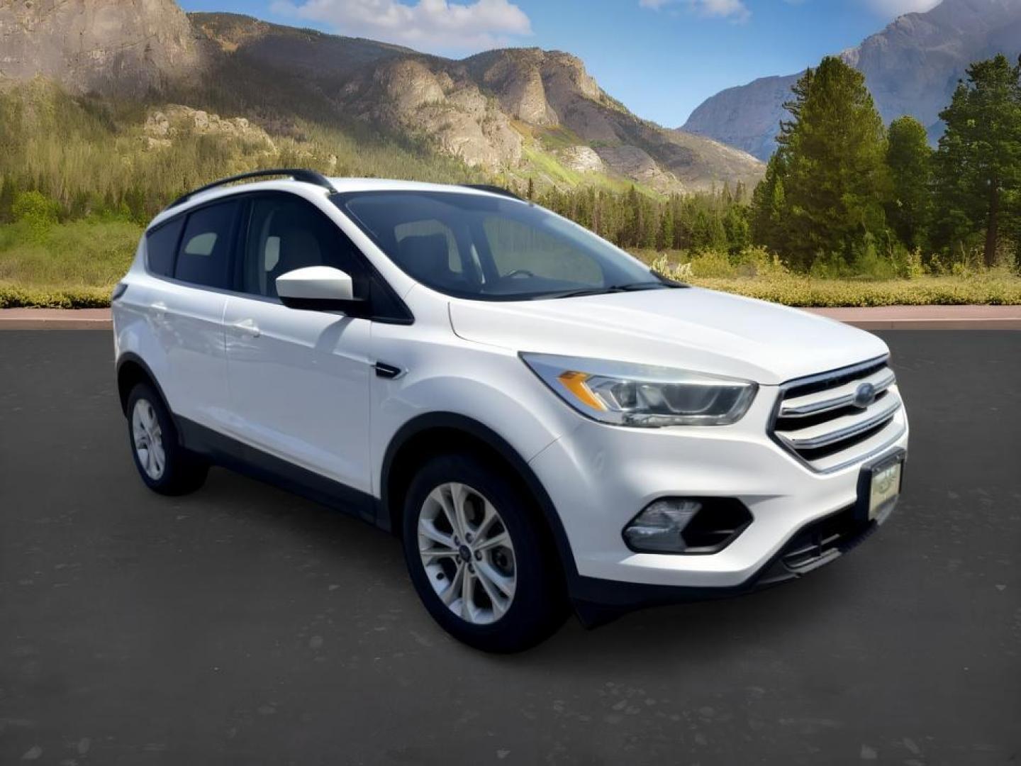 2018 WHITE /Medium Light Stone Ford Escape (1FMCU9HD1JU) with an EcoBoost 15L I-4 gasoline direct injection engine, Automatic transmission, located at 1175 N Woodruff Ave, Idaho Falls, ID, 83401, 43.506901, -111.999657 - At Timberline Auto, finding a great deal on your next vehicle is always easy! Our experienced sales staff goal is to help find you the right vehicle at the right price! Our knowledgeable finance department has options for almost any credit score. We offer extended service contract options to prot- Photo#10