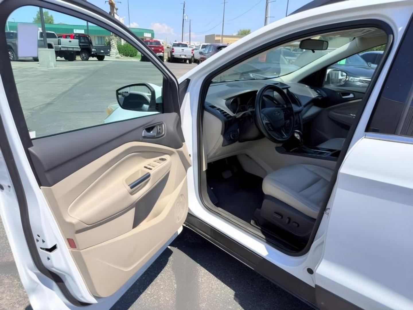 2018 WHITE /Medium Light Stone Ford Escape (1FMCU9HD1JU) with an EcoBoost 15L I-4 gasoline direct injection engine, Automatic transmission, located at 1175 N Woodruff Ave, Idaho Falls, ID, 83401, 43.506901, -111.999657 - At Timberline Auto, finding a great deal on your next vehicle is always easy! Our experienced sales staff goal is to help find you the right vehicle at the right price! Our knowledgeable finance department has options for almost any credit score. We offer extended service contract options to prot- Photo#14