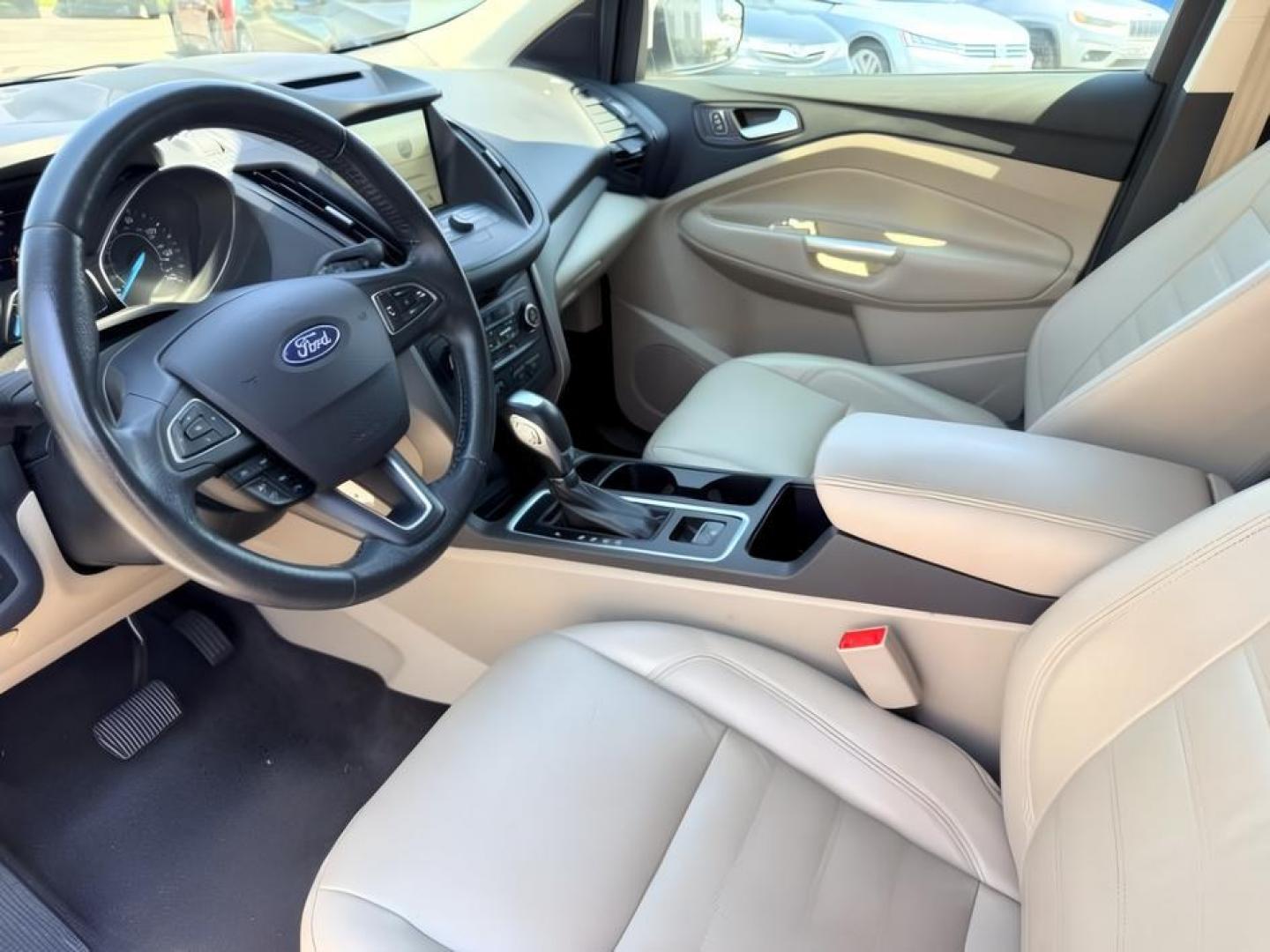 2018 WHITE /Medium Light Stone Ford Escape (1FMCU9HD1JU) with an EcoBoost 15L I-4 gasoline direct injection engine, Automatic transmission, located at 1175 N Woodruff Ave, Idaho Falls, ID, 83401, 43.506901, -111.999657 - At Timberline Auto, finding a great deal on your next vehicle is always easy! Our experienced sales staff goal is to help find you the right vehicle at the right price! Our knowledgeable finance department has options for almost any credit score. We offer extended service contract options to prot- Photo#16