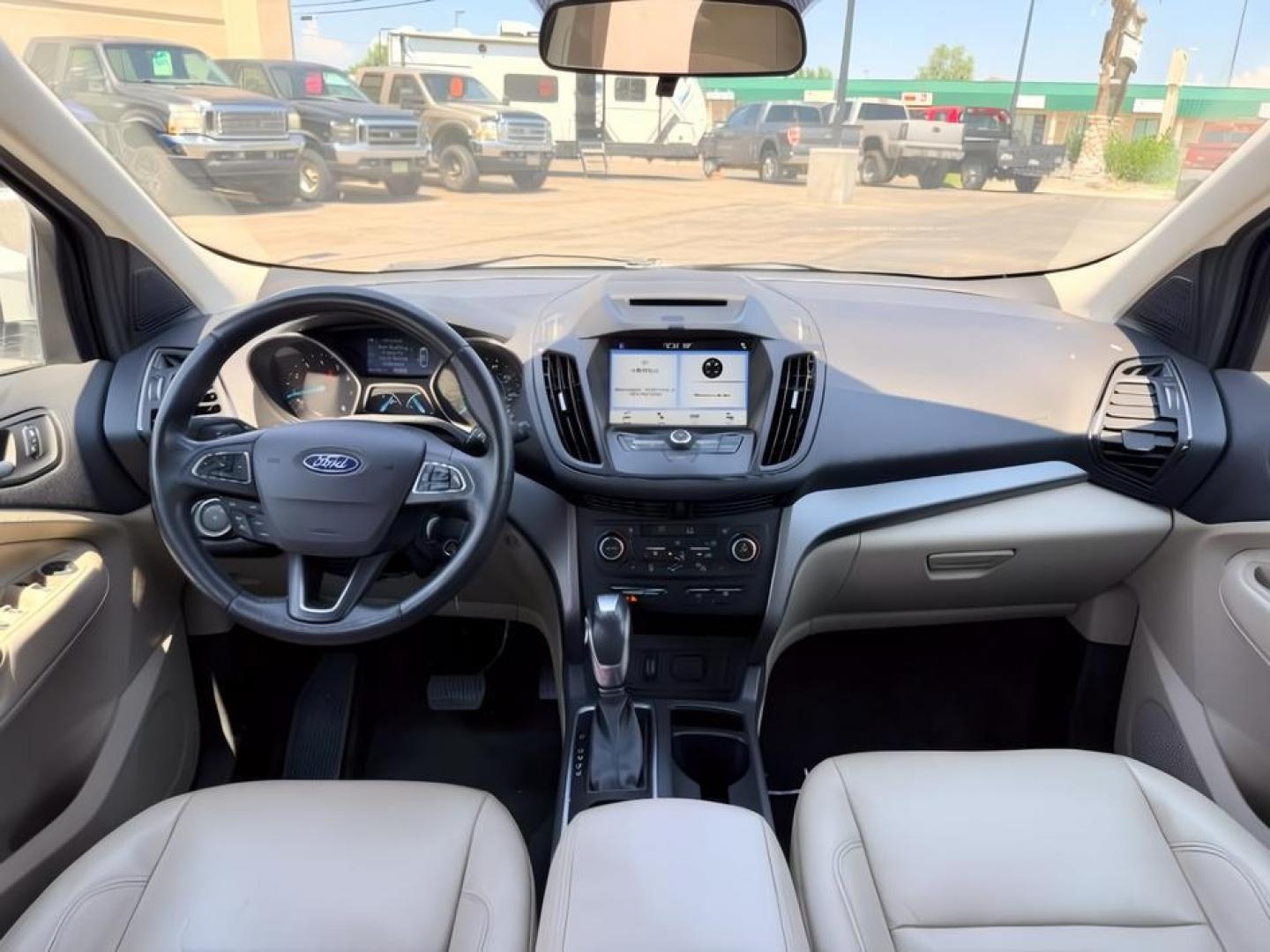 2018 WHITE /Medium Light Stone Ford Escape (1FMCU9HD1JU) with an EcoBoost 15L I-4 gasoline direct injection engine, Automatic transmission, located at 1175 N Woodruff Ave, Idaho Falls, ID, 83401, 43.506901, -111.999657 - At Timberline Auto, finding a great deal on your next vehicle is always easy! Our experienced sales staff goal is to help find you the right vehicle at the right price! Our knowledgeable finance department has options for almost any credit score. We offer extended service contract options to prot- Photo#25