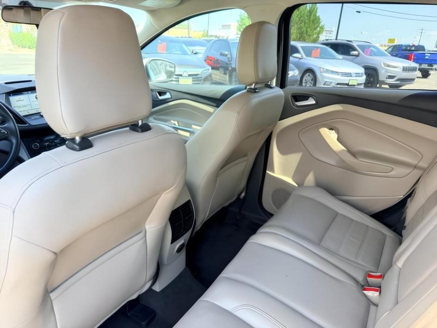 2018 WHITE /Medium Light Stone Ford Escape (1FMCU9HD1JU) with an EcoBoost 15L I-4 gasoline direct injection engine, Automatic transmission, located at 1175 N Woodruff Ave, Idaho Falls, ID, 83401, 43.506901, -111.999657 - At Timberline Auto, finding a great deal on your next vehicle is always easy! Our experienced sales staff goal is to help find you the right vehicle at the right price! Our knowledgeable finance department has options for almost any credit score. We offer extended service contract options to prot- Photo#26