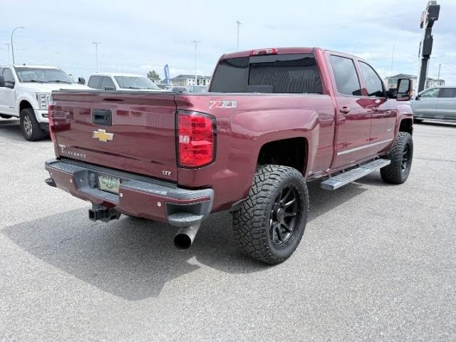 2015 MAROON /Jet Black Chevrolet Silverado 2500HD (1GC1KWE82FF) with an 66L V8 16V OHV TURBO DIESEL engine, Automatic transmission, located at 1175 N Woodruff Ave, Idaho Falls, ID, 83401, 43.506901, -111.999657 - At Timberline Auto, finding a great deal on your next vehicle is always easy! Our experienced sales staff goal is to help find you the right vehicle at the right price! Our knowledgeable finance department has options for almost any credit score. We offer extended service contract options to prot- Photo#35
