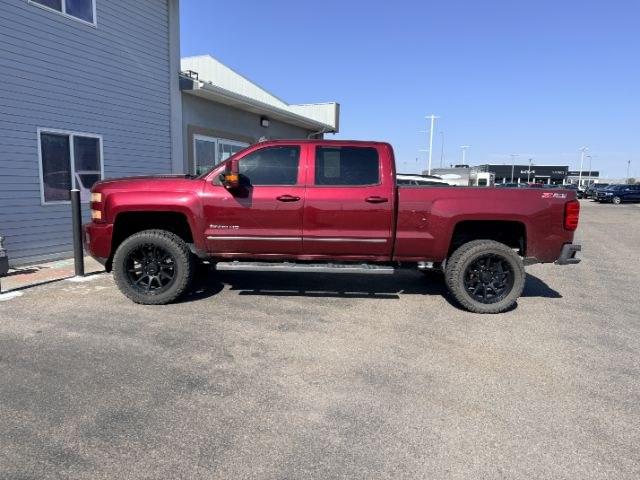 2015 MAROON /Jet Black Chevrolet Silverado 2500HD LTZ (1GC1KWE82FF) with an 6.6L V8 16V OHV TURBO DIESEL engine, AUTOMATIC transmission, located at 1235 N Woodruff Ave., Idaho Falls, 83401, (208) 523-1053, 43.507172, -112.000488 - At Timberline Auto, finding a great deal on your next vehicle is always easy! Our experienced sales staff goal is to help find you the right vehicle at the right price! Our knowledgeable finance department has options for almost any credit score. We offer extended service contract options to prot- Photo#1