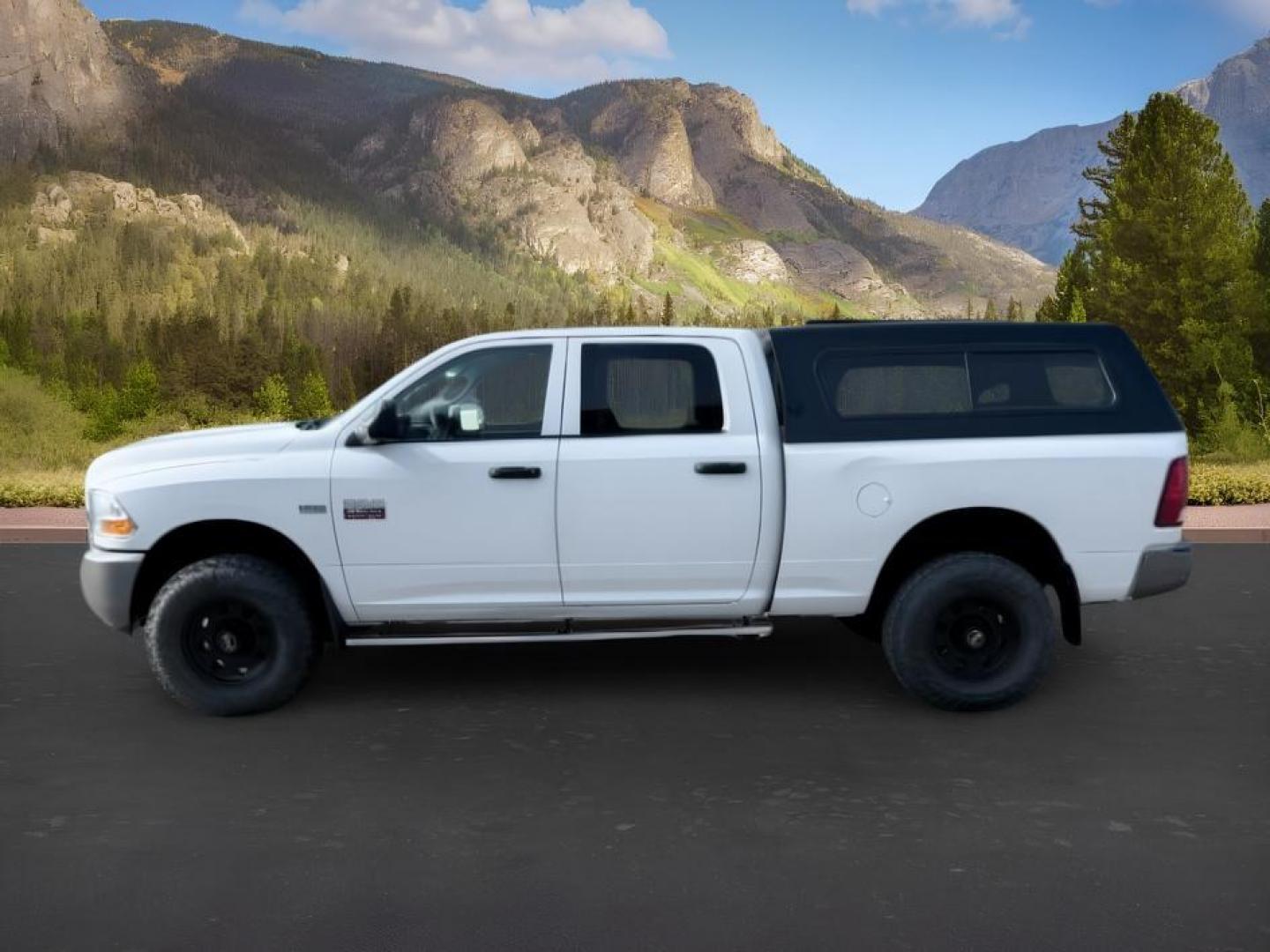 2011 WHITE /Dark Slate/Medium Graystone Ram Ram 2500 (3D7TT2CT6BG) with an HEMI Magnum 57L V-8 variable valve control engine, Automatic transmission, located at 1175 N Woodruff Ave, Idaho Falls, ID, 83401, 43.506901, -111.999657 - At Timberline Auto, finding a great deal on your next vehicle is always easy! Our experienced sales staff goal is to help find you the right vehicle at the right price! Our knowledgeable finance department has options for almost any credit score. We offer extended service contract options to prot- Photo#1