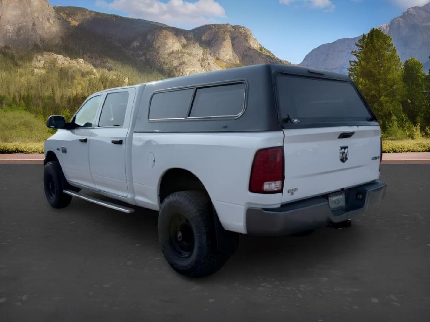 2011 WHITE /Dark Slate/Medium Graystone Ram Ram 2500 (3D7TT2CT6BG) with an HEMI Magnum 57L V-8 variable valve control engine, Automatic transmission, located at 1175 N Woodruff Ave, Idaho Falls, ID, 83401, 43.506901, -111.999657 - At Timberline Auto, finding a great deal on your next vehicle is always easy! Our experienced sales staff goal is to help find you the right vehicle at the right price! Our knowledgeable finance department has options for almost any credit score. We offer extended service contract options to prot- Photo#2