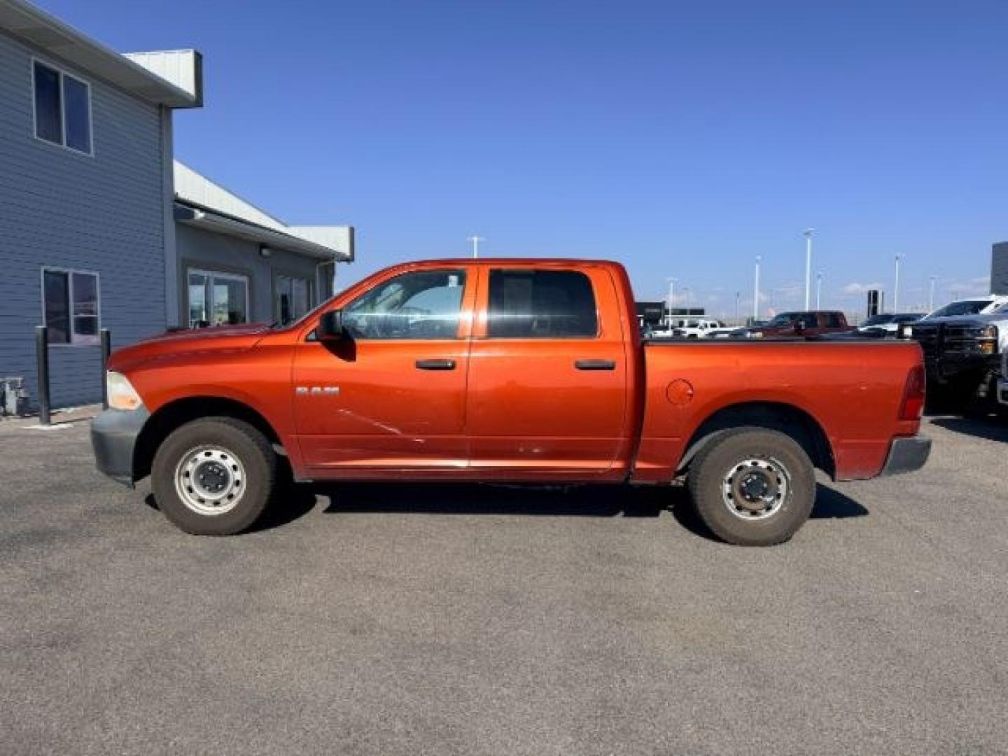 2009 ORANGE /CLOTH Dodge Ram 1500 (1D3HV13P09S) with an 47L V8 MAGNUM engine, Automatic transmission, located at 1175 N Woodruff Ave, Idaho Falls, ID, 83401, 43.506901, -111.999657 - At Timberline Auto, finding a great deal on your next vehicle is always easy! Our experienced sales staff goal is to help find you the right vehicle at the right price! Our knowledgeable finance department has options for almost any credit score. We offer extended service contract options to prot- Photo#1