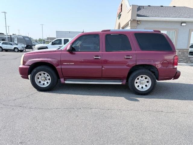 2004 RED /TAN Cadillac Escalade LUXURY (1GYEK63NX4R) with an 6.0L engine, AUTOMATIC transmission, located at 1235 N Woodruff Ave., Idaho Falls, 83401, (208) 523-1053, 43.507172, -112.000488 - At Timberline Auto, finding a great deal on your next vehicle is always easy! Our experienced sales staff goal is to help find you the right vehicle at the right price! Our knowledgeable finance department has options for almost any credit score. We offer extended service contract options to prot- Photo#1