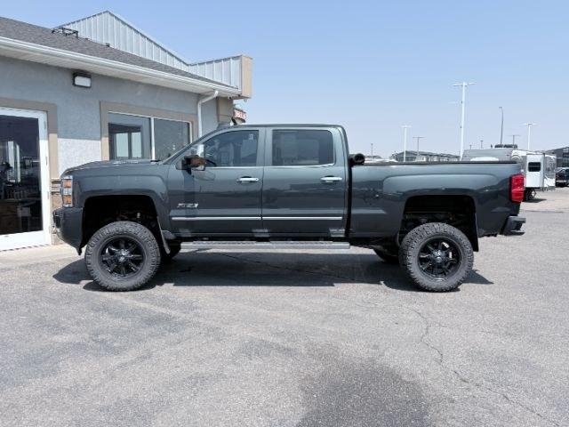 2017 GRAY /Jet Black/Medium Ash Gray Chevrolet Silverado 3500HD High Country (1GC4K1EY4HF) with an 6.6L V8 16V OHV TURBO DIESEL engine, AUTOMATIC transmission, located at 1235 N Woodruff Ave., Idaho Falls, 83401, (208) 523-1053, 43.507172, -112.000488 - At Timberline Auto, finding a great deal on your next vehicle is always easy! Our experienced sales staff goal is to help find you the right vehicle at the right price! Our knowledgeable finance department has options for almost any credit score. We offer extended service contract options to prot- Photo#1