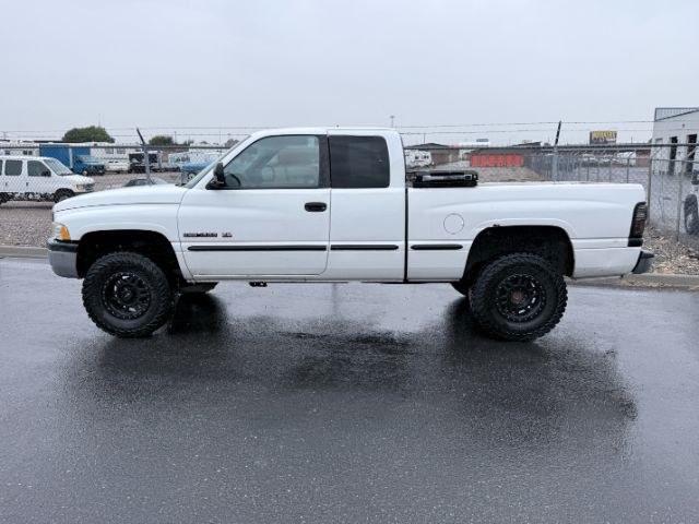 1998 WHITE /Mist Grey Dodge Ram 1500 (3B7HF12Y3WM) with an Magnum 52L V-8 regular unleaded engine, Manual transmission, located at 1175 N Woodruff Ave, Idaho Falls, ID, 83401, 43.506901, -111.999657 - At Timberline Auto, finding a great deal on your next vehicle is always easy! Our experienced sales staff goal is to help find you the right vehicle at the right price! Our knowledgeable finance department has options for almost any credit score. We offer extended service contract options to prot- Photo#1